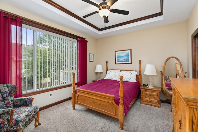 6054 Bradford Ln, Johnston, IA 50131 - bedroom featuring light colored carpet, a tray ceiling, ornamental molding, and ceiling fan