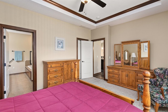 6054 Bradford Ln, Johnston, IA 50131 - bedroom featuring crown molding, a raised ceiling, ceiling fan, and ensuite bath