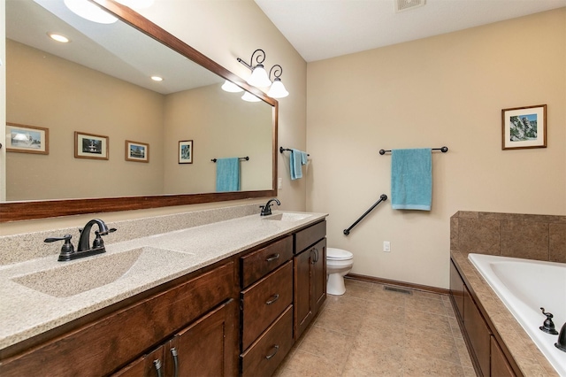 6054 Bradford Ln, Johnston, IA 50131 - bathroom with a garden tub, double vanity, tile patterned floors, and recessed lighting