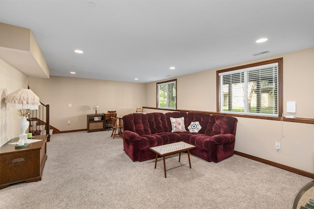 6054 Bradford Ln, Johnston, IA 50131 - living room featuring carpet flooring, stairs, and recessed lighting