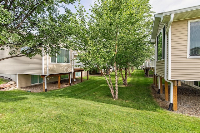 6054 Bradford Ln, Johnston, IA 50131 - view of green lawn featuring a deck