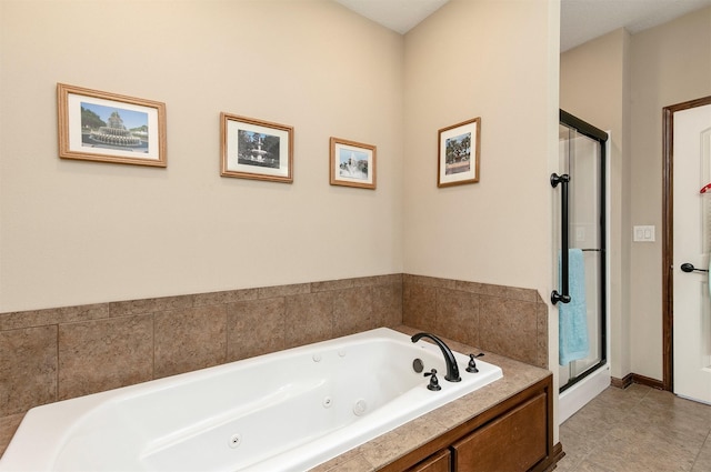 6054 Bradford Ln, Johnston, IA 50131 - bathroom featuring a jetted tub, a stall shower, and tile patterned floors
