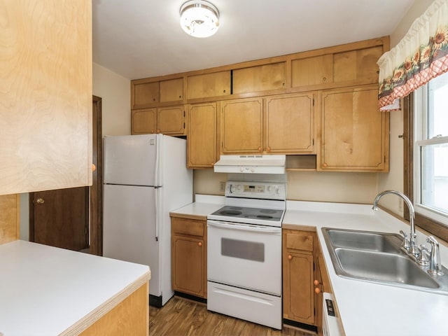 1122 E Ave E, Albia, IA 52531 - kitchen featuring white appliances, under cabinet range hood, light countertops, and wood finished floors