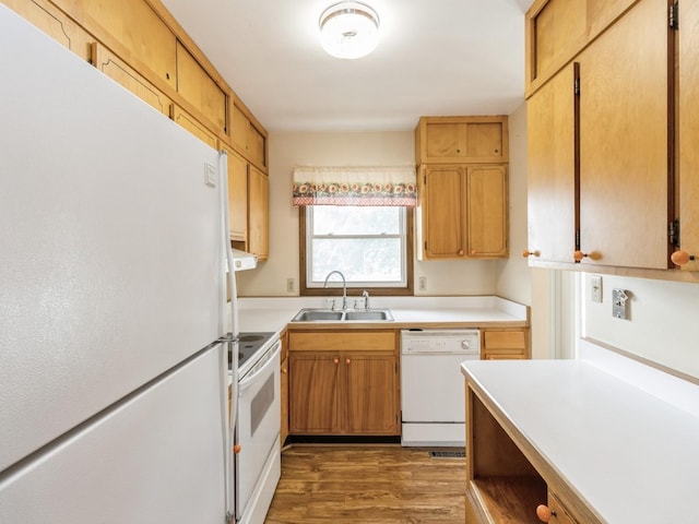 1122 E Ave E, Albia, IA 52531 - kitchen featuring white appliances, wood finished floors, and light countertops