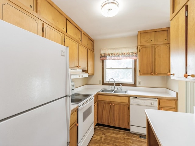 1122 E Ave E, Albia, IA 52531 - kitchen with white appliances, under cabinet range hood, light countertops, and wood finished floors