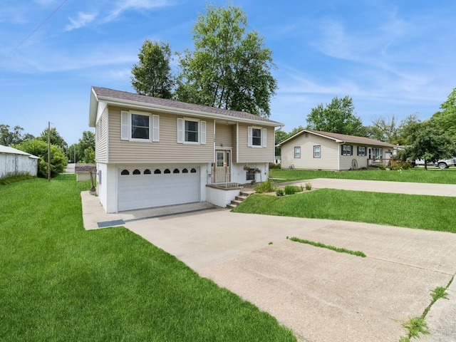 1122 E Ave E, Albia, IA 52531 - view of front facade with concrete driveway, a garage, and a front yard