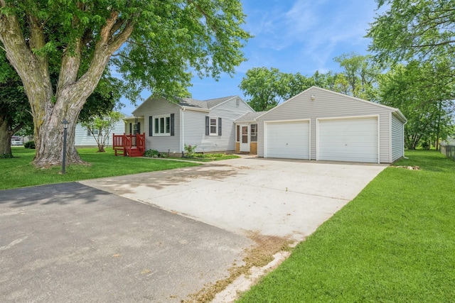 4326 E Washburn Rd, Waterloo, IA 50702 - single story home featuring a front yard, driveway, an attached garage, and an outdoor structure