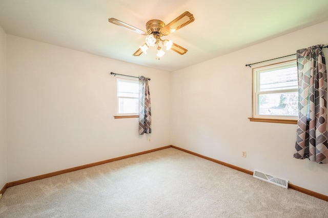 4326 E Washburn Rd, Waterloo, IA 50702 - spare room with carpet and a ceiling fan
