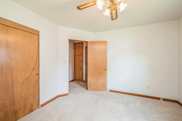 4326 E Washburn Rd, Waterloo, IA 50702 - unfurnished bedroom featuring carpet flooring and a ceiling fan