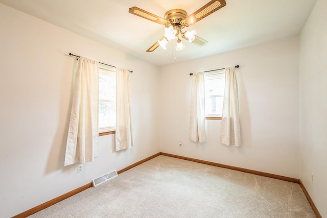 4326 E Washburn Rd, Waterloo, IA 50702 - empty room featuring plenty of natural light, carpet, and ceiling fan