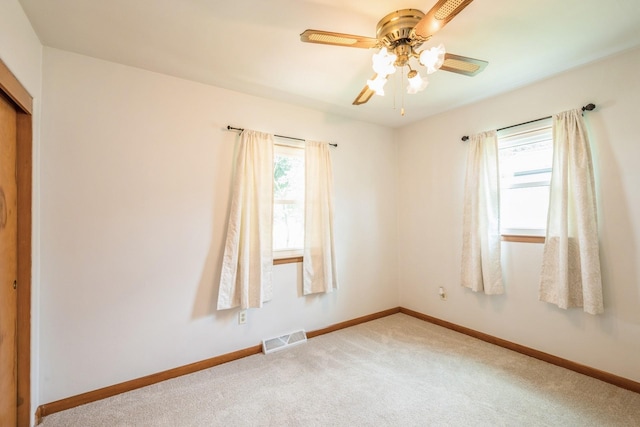4326 E Washburn Rd, Waterloo, IA 50702 - unfurnished room with a ceiling fan and light carpet