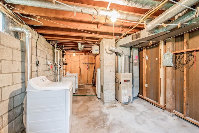 4326 E Washburn Rd, Waterloo, IA 50702 - unfinished below grade area featuring washer and clothes dryer, water heater, and heating unit