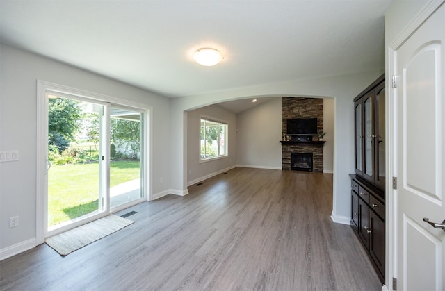 296 S 82nd St, West Des Moines, IA 50266 - unfurnished living room with wood finished floors and a fireplace