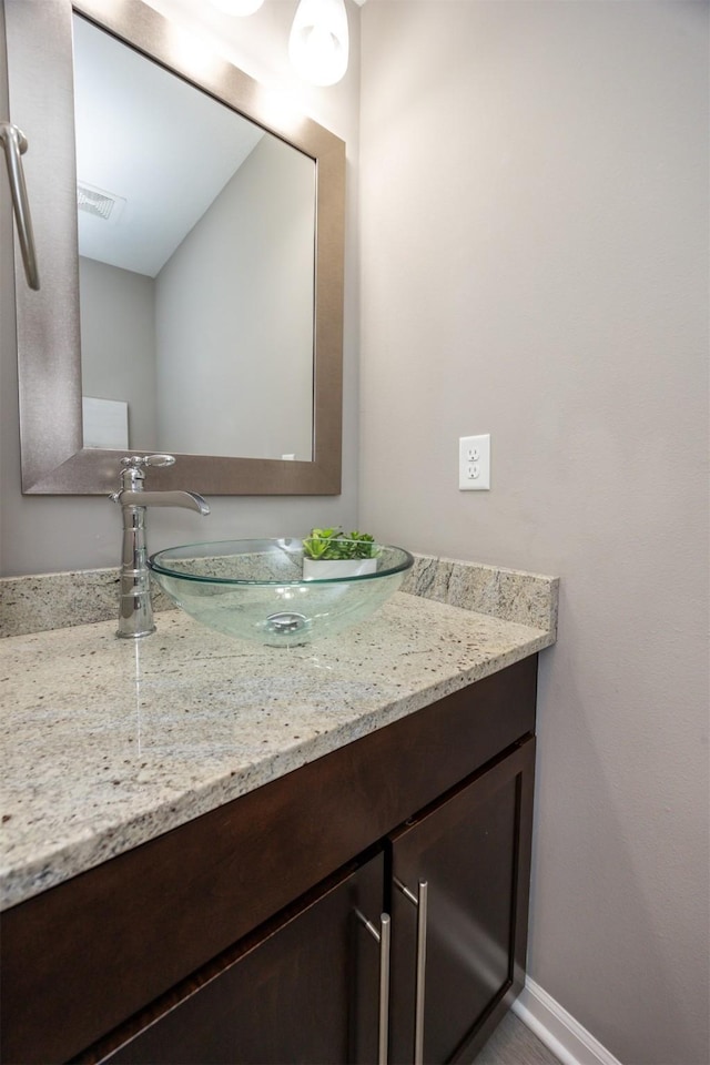 296 S 82nd St, West Des Moines, IA 50266 - bathroom featuring vanity and baseboards