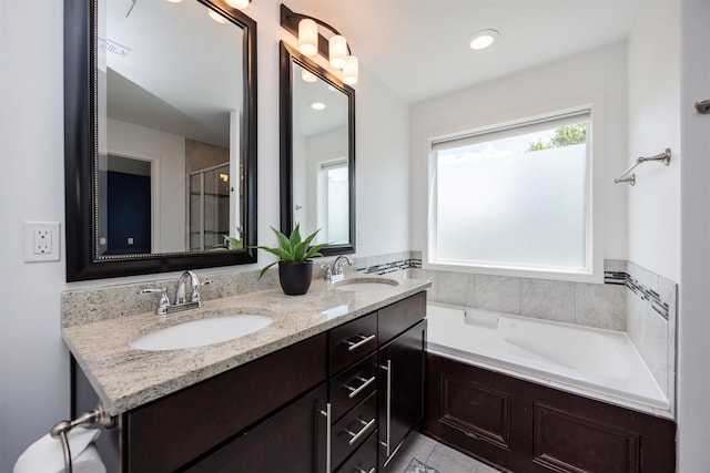 296 S 82nd St, West Des Moines, IA 50266 - full bath featuring a bath, double vanity, tile patterned floors, and an enclosed shower