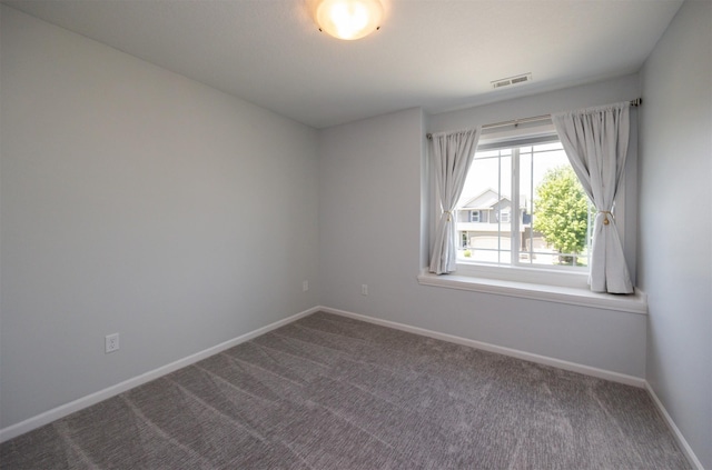 296 S 82nd St, West Des Moines, IA 50266 - unfurnished room featuring baseboards and dark colored carpet