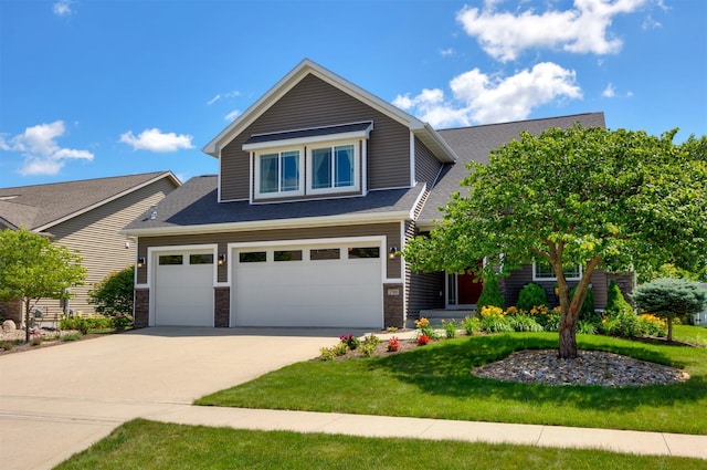 296 S 82nd St, West Des Moines, IA 50266 - view of front facade featuring concrete driveway, a front lawn, roof with shingles, stone siding, and a garage