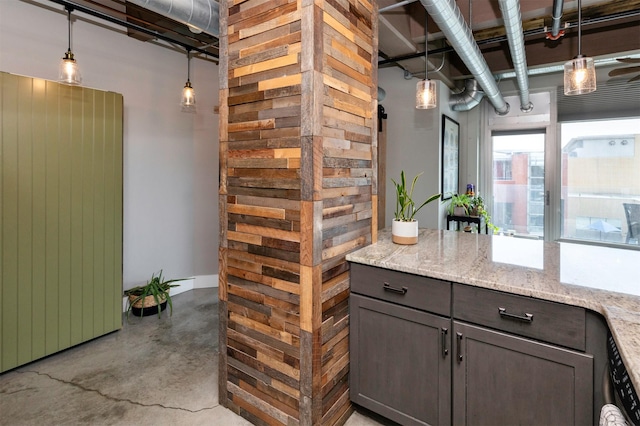 120 SW 5th St Unit 306, Des Moines, IA 50309 - bar with concrete flooring and pendant lighting