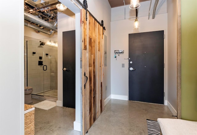 120 SW 5th St Unit 306, Des Moines, IA 50309 - foyer featuring finished concrete flooring and a barn door