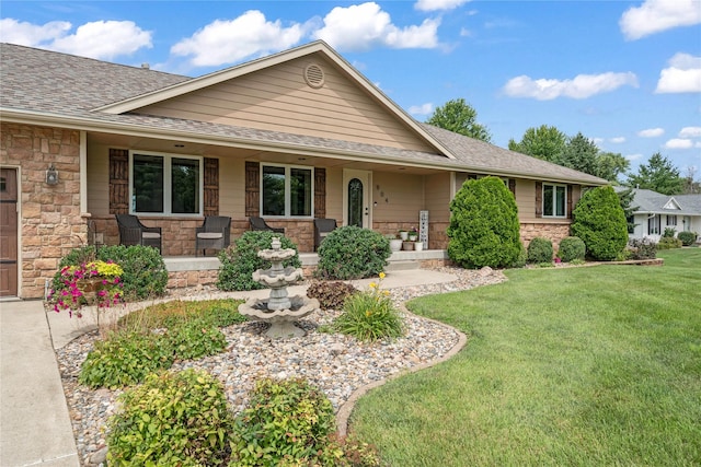 904 Pleasant St SE, Bondurant, IA 50035 - ranch-style house with covered porch, stone siding, a front lawn, and a shingled roof