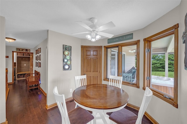 904 Pleasant St SE, Bondurant, IA 50035 - dining room with dark wood-style flooring and a ceiling fan