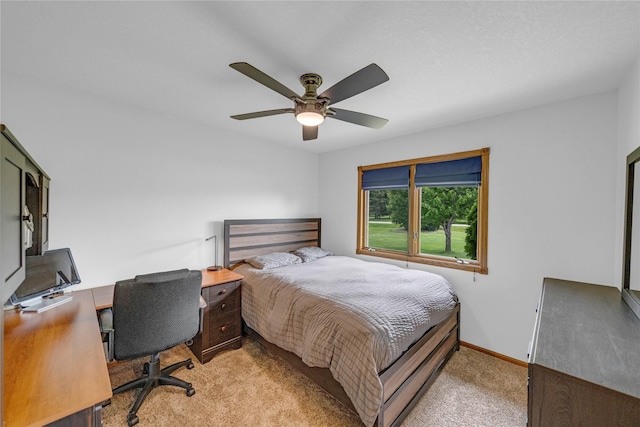 904 Pleasant St SE, Bondurant, IA 50035 - bedroom featuring light colored carpet, a ceiling fan, and a desk