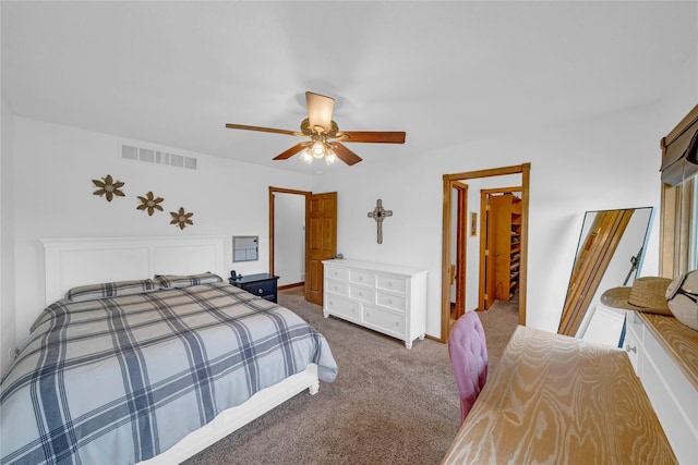 904 Pleasant St SE, Bondurant, IA 50035 - bedroom featuring dark colored carpet and a ceiling fan