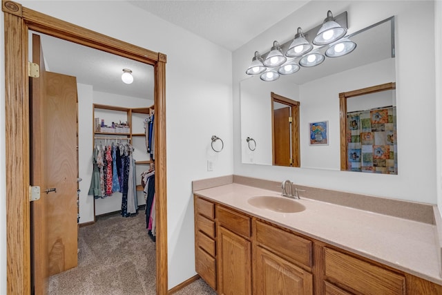 904 Pleasant St SE, Bondurant, IA 50035 - full bathroom with vanity and a spacious closet