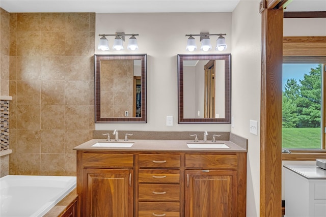 904 Pleasant St SE, Bondurant, IA 50035 - bathroom with a bath and double vanity