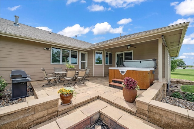 904 Pleasant St SE, Bondurant, IA 50035 - view of patio with a hot tub, area for grilling, a ceiling fan, and outdoor dining space