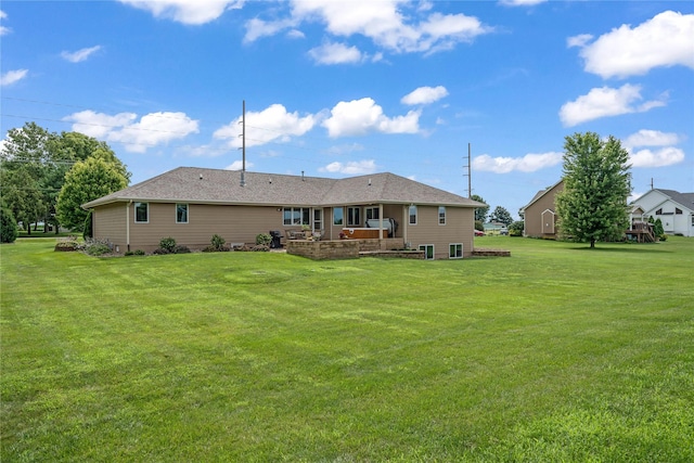 904 Pleasant St SE, Bondurant, IA 50035 - back of house featuring a lawn