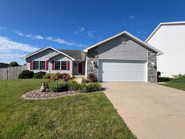 4806 Waller St, Ames, IA 50014 - ranch-style house with stone siding, a garage, and driveway