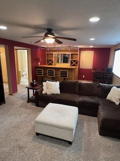 4806 Waller St, Ames, IA 50014 - living room with light carpet, a textured ceiling, ceiling fan, and recessed lighting