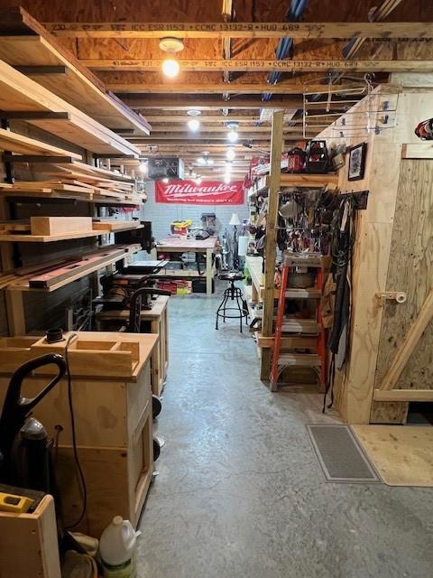 4806 Waller St, Ames, IA 50014 - unfinished below grade area featuring a workshop area