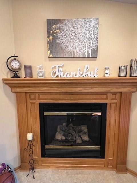 4806 Waller St, Ames, IA 50014 - detailed view of a glass covered fireplace and baseboards
