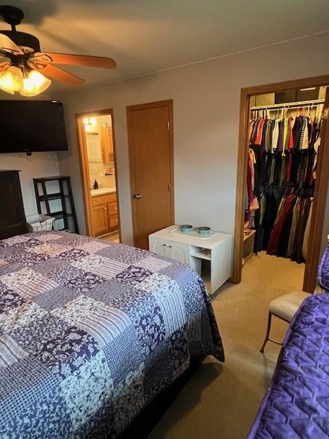 4806 Waller St, Ames, IA 50014 - bedroom featuring a closet, light colored carpet, ceiling fan, and connected bathroom