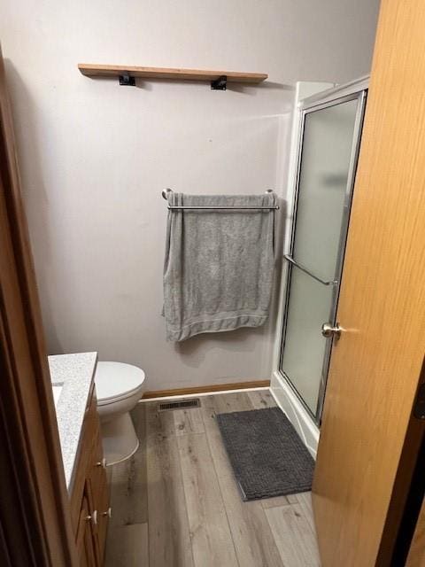 4806 Waller St, Ames, IA 50014 - bathroom with vanity, wood finished floors, and a stall shower