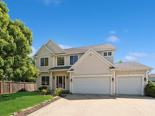 705 SE Whitetail Ln, Waukee, IA 50263 - traditional-style home with concrete driveway, an attached garage, and roof with shingles
