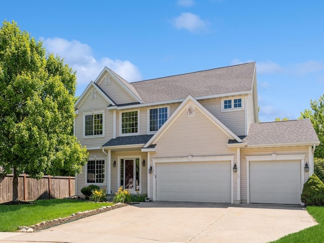 705 SE Whitetail Ln, Waukee, IA 50263 - traditional-style home featuring concrete driveway, an attached garage, and roof with shingles