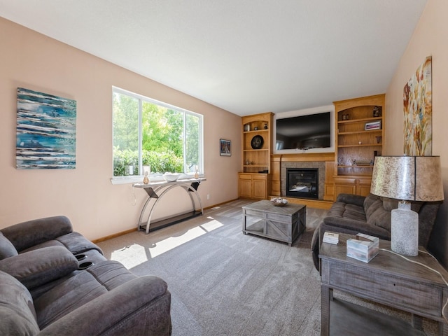 705 SE Whitetail Ln, Waukee, IA 50263 - living area featuring light carpet and a tile fireplace