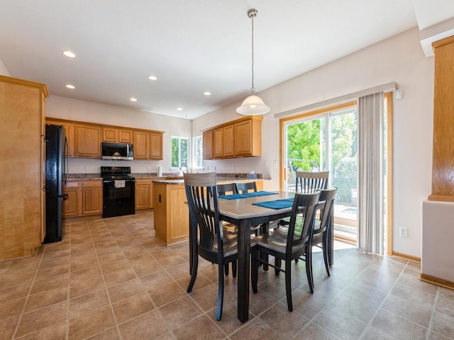 705 SE Whitetail Ln, Waukee, IA 50263 - dining space with plenty of natural light, recessed lighting, and light tile patterned floors