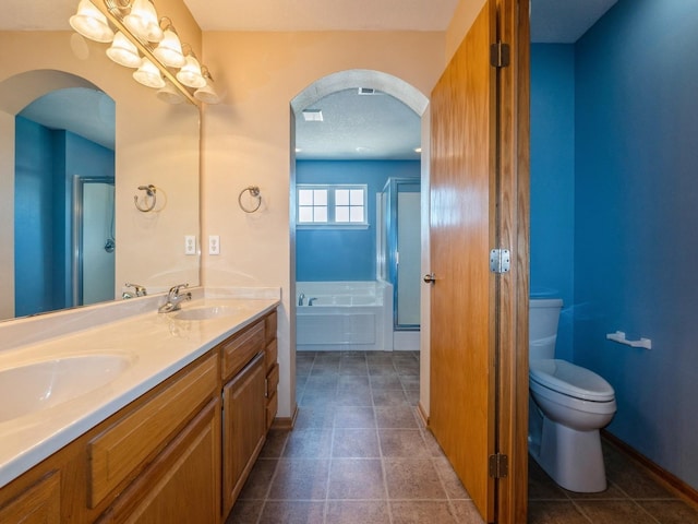 705 SE Whitetail Ln, Waukee, IA 50263 - full bathroom with a stall shower, double vanity, a bath, and tile patterned flooring