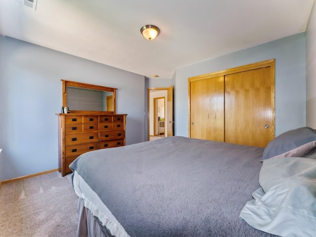 705 SE Whitetail Ln, Waukee, IA 50263 - bedroom with light carpet and a closet