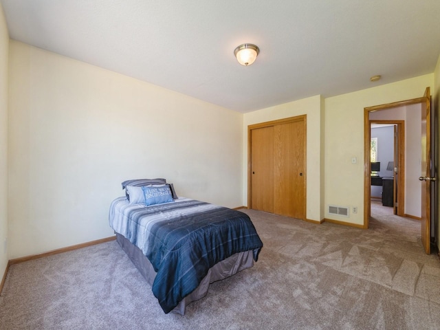 705 SE Whitetail Ln, Waukee, IA 50263 - carpeted bedroom with baseboards and a closet