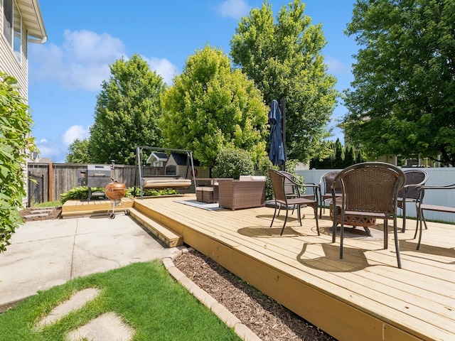 705 SE Whitetail Ln, Waukee, IA 50263 - wooden terrace featuring a fenced backyard