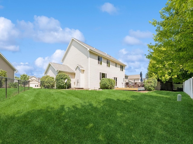 705 SE Whitetail Ln, Waukee, IA 50263 - back of property with a wooden deck