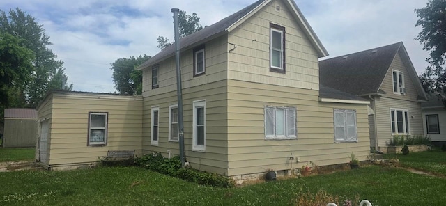 1924 4th St, Perry, IA 50220 - view of property exterior with a yard