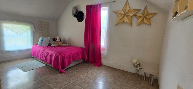 1924 4th St, Perry, IA 50220 - bedroom with lofted ceiling and multiple windows