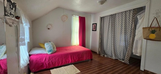 1924 4th St, Perry, IA 50220 - bedroom with wood finished floors and vaulted ceiling