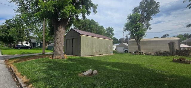 1924 4th St, Perry, IA 50220 - view of green lawn with a storage shed